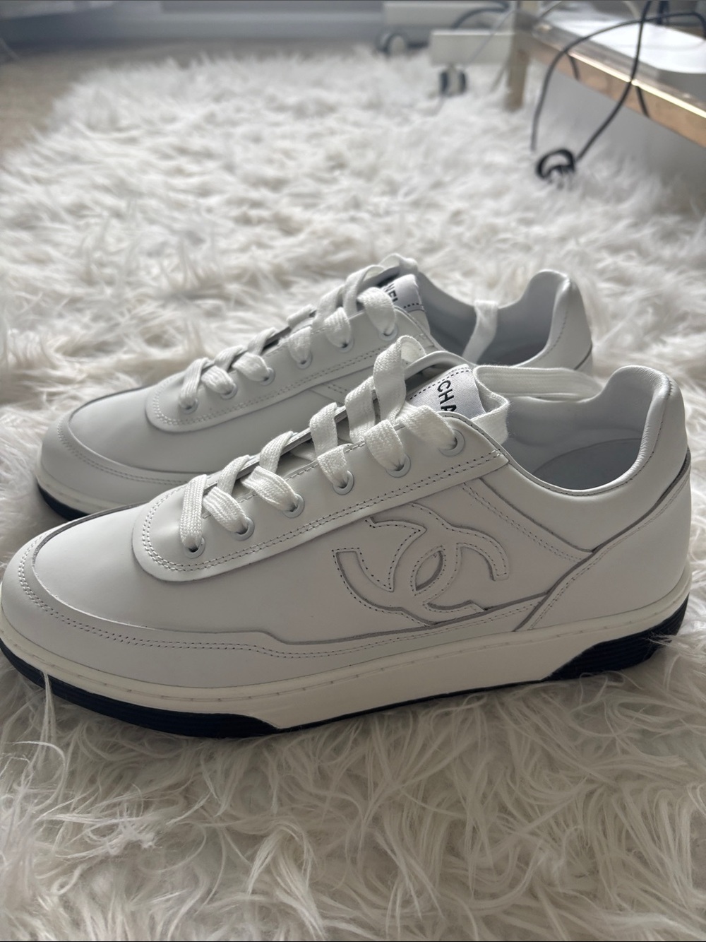 CHANEL White Leather Men's Sneakers with Black Sole Accent